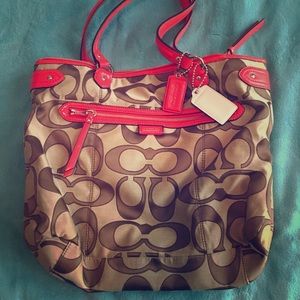 Coach with bright orange trim